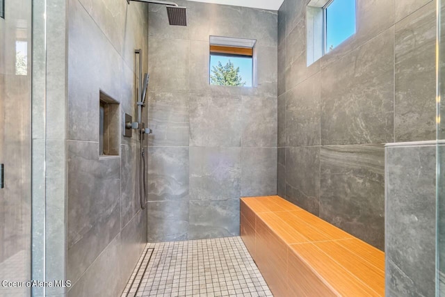 bathroom with tiled shower