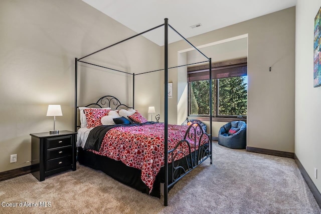 bedroom with light colored carpet