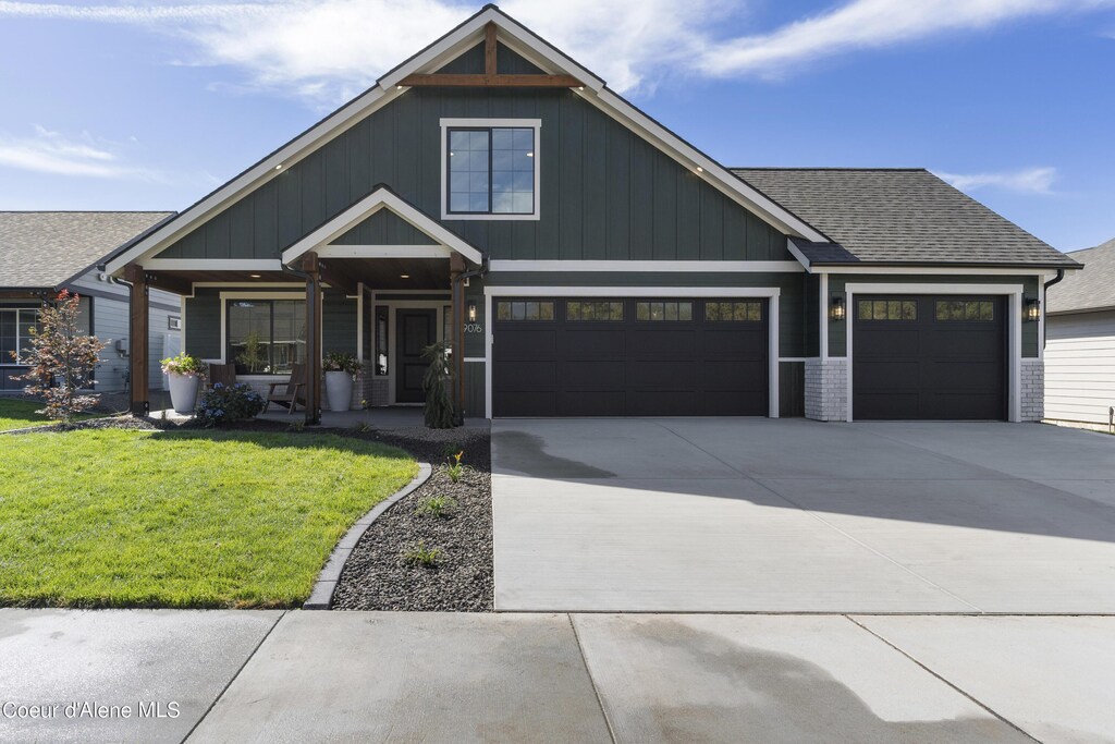 view of front facade with a garage and a front lawn