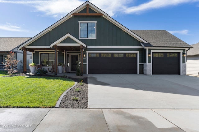 view of front facade with a garage and a front lawn