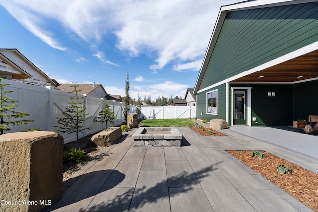 view of patio / terrace with an outdoor fire pit