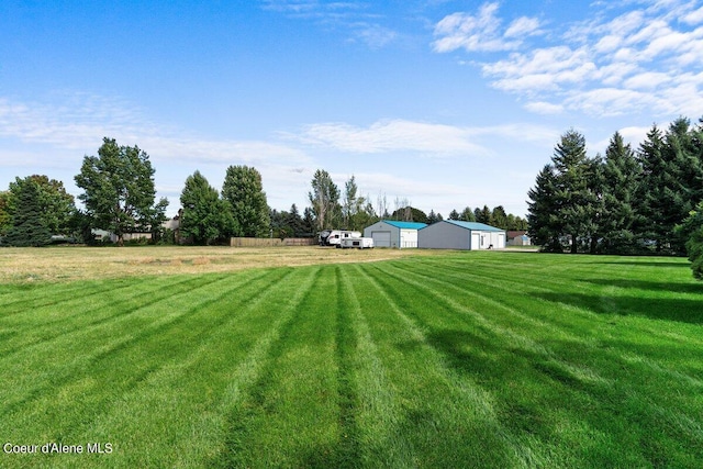 view of yard with a rural view