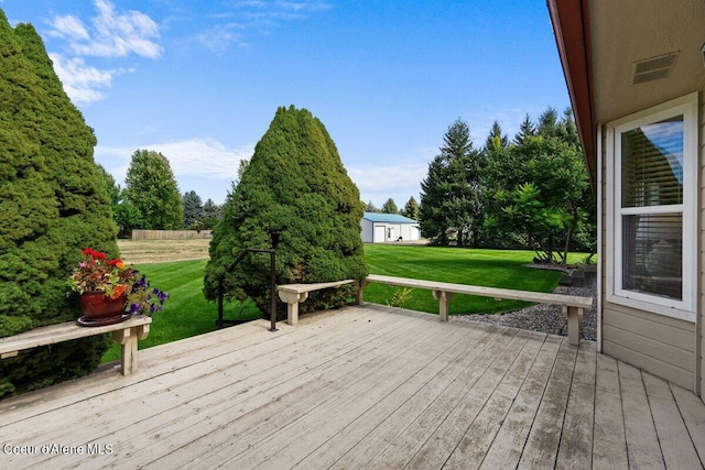 wooden deck with a lawn