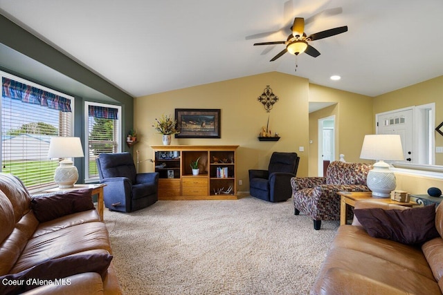 living room with carpet floors, lofted ceiling, and ceiling fan