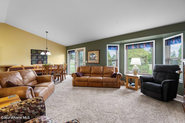 living room with lofted ceiling and carpet flooring