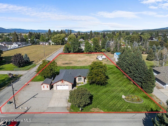 birds eye view of property with a mountain view