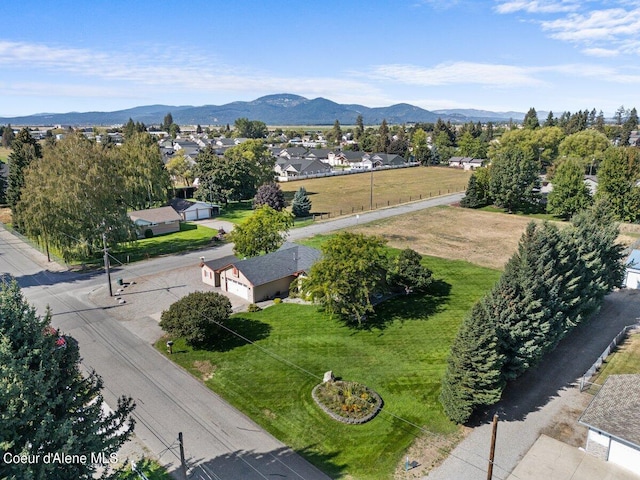 birds eye view of property with a mountain view