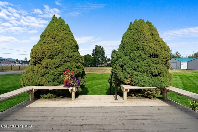 exterior space featuring a lawn and a deck