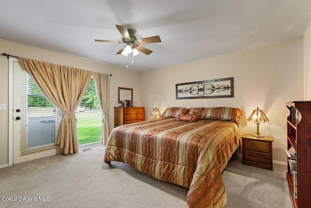 carpeted bedroom with ceiling fan and access to outside