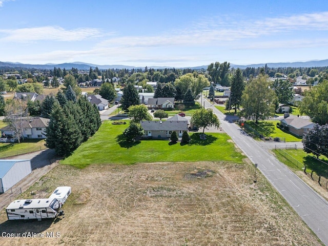 birds eye view of property featuring a mountain view