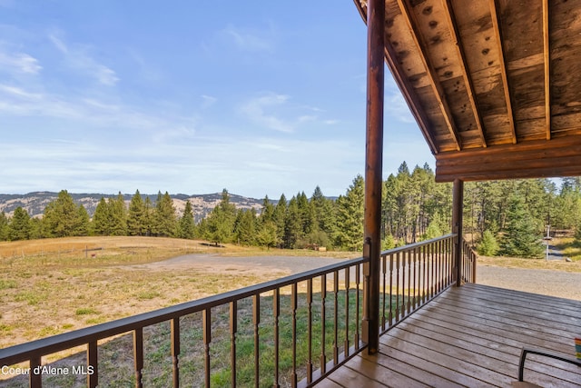 wooden terrace featuring a mountain view