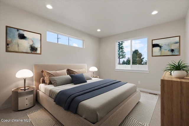 bedroom featuring carpet floors and multiple windows