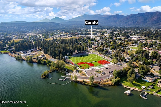 drone / aerial view featuring a water and mountain view