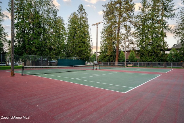 view of sport court featuring community basketball court and fence