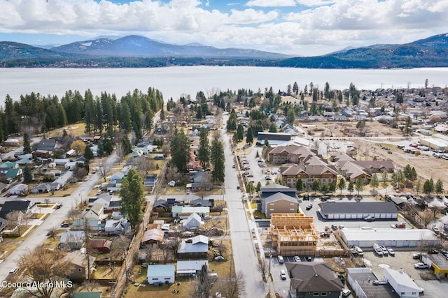 drone / aerial view with a residential view and a water and mountain view