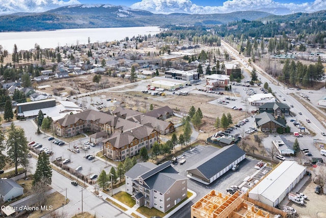 aerial view featuring a water and mountain view