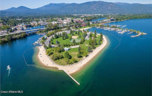 aerial view featuring a water and mountain view