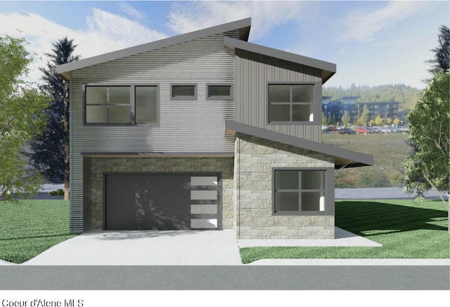 modern home featuring a front yard and a garage