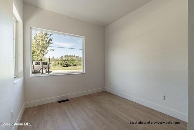 unfurnished room featuring light hardwood / wood-style flooring