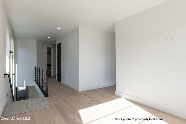 spare room with light wood-type flooring