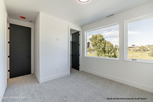 unfurnished bedroom with light carpet