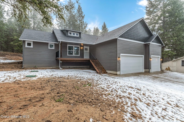 view of front of home with a porch and a garage