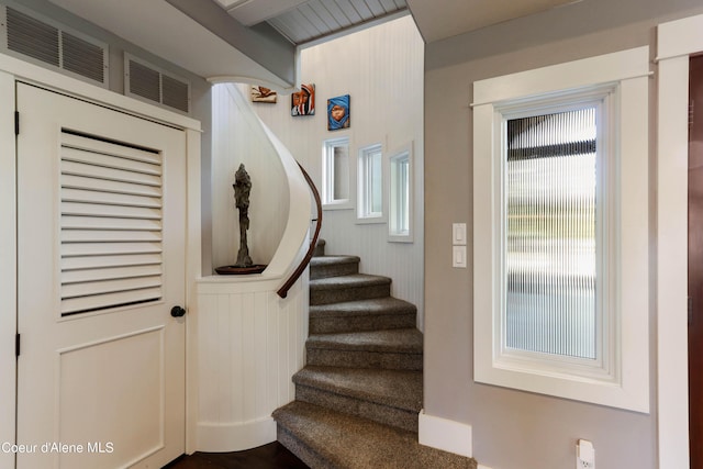 staircase featuring visible vents