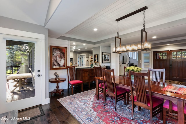 dining space with an inviting chandelier, dark hardwood / wood-style floors, and wooden ceiling