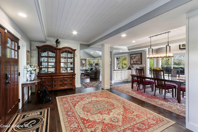 entrance foyer with wood ceiling, dark wood-style flooring, decorative columns, and recessed lighting