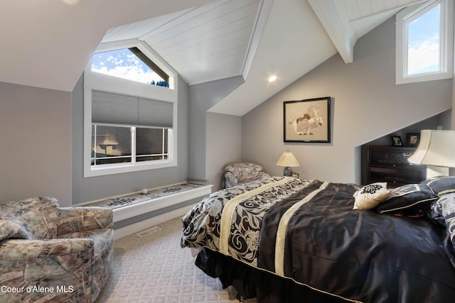 bedroom featuring visible vents, carpet floors, vaulted ceiling with beams, and multiple windows