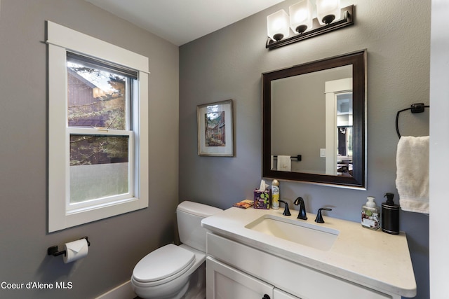 bathroom with toilet and vanity