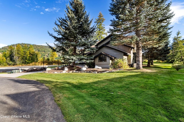 view of property exterior with a lawn