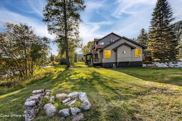 view of side of property with a yard