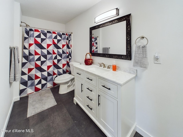 bathroom featuring vanity and toilet