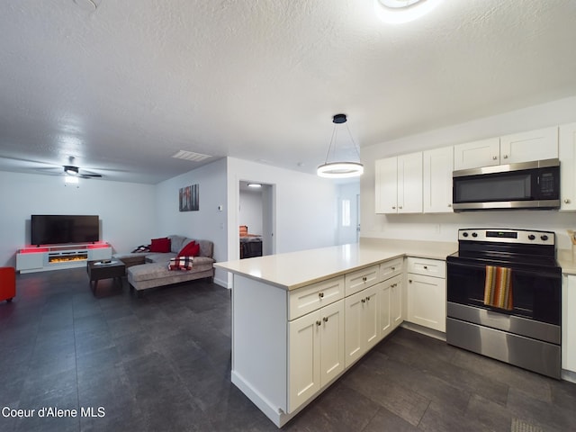 kitchen with white cabinetry, ceiling fan, hanging light fixtures, stainless steel appliances, and kitchen peninsula