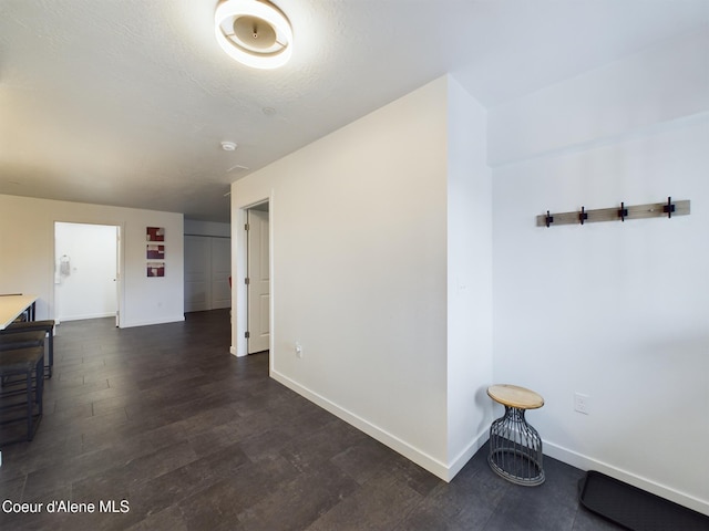 corridor featuring dark hardwood / wood-style floors