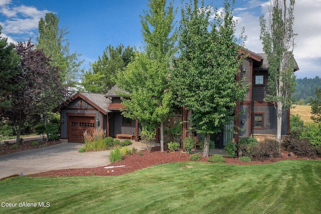 17021 S Citrine Dr, Coeur Dalene, ID 83814 - view of front of home featuring concrete driveway, a front lawn, and a garage