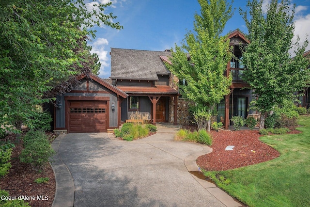 17021 S Citrine Dr, Coeur Dalene, ID 83814 - view of front facade with an attached garage, driveway, stone siding, and covered porch