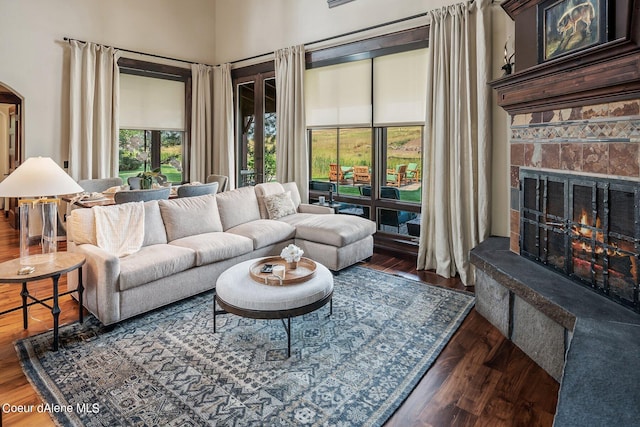 17021 S Citrine Dr, Coeur Dalene, ID 83814 - living area featuring a towering ceiling, wood finished floors, and a stone fireplace