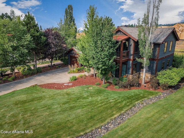 17021 S Citrine Dr, Coeur Dalene, ID 83814 - view of yard with a garage, concrete driveway, and a balcony