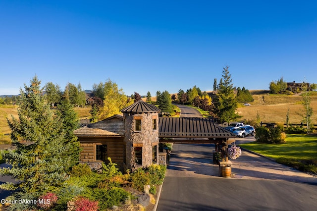 17021 S Citrine Dr, Coeur Dalene, ID 83814 - view of front of house featuring stone siding, a standing seam roof, and metal roof