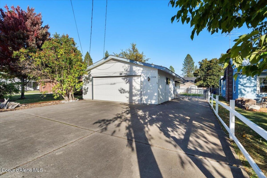 view of side of home with a garage