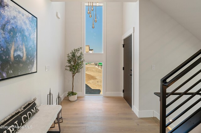 2747 W Lumber Ln, Coeur Dalene, ID 83814 - entryway with wood finished floors, stairway, and baseboards