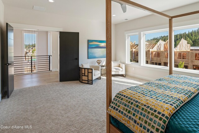2747 W Lumber Ln, Coeur Dalene, ID 83814 - carpeted bedroom with multiple windows, baseboards, and recessed lighting
