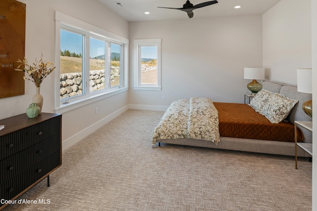 carpeted bedroom featuring ceiling fan