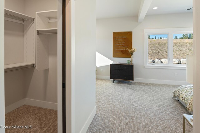 2747 W Lumber Ln, Coeur Dalene, ID 83814 - carpeted bedroom with baseboards and beam ceiling
