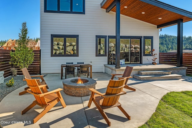 view of patio / terrace with an outdoor fire pit