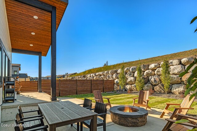 2747 W Lumber Ln, Coeur Dalene, ID 83814 - view of patio featuring a fire pit