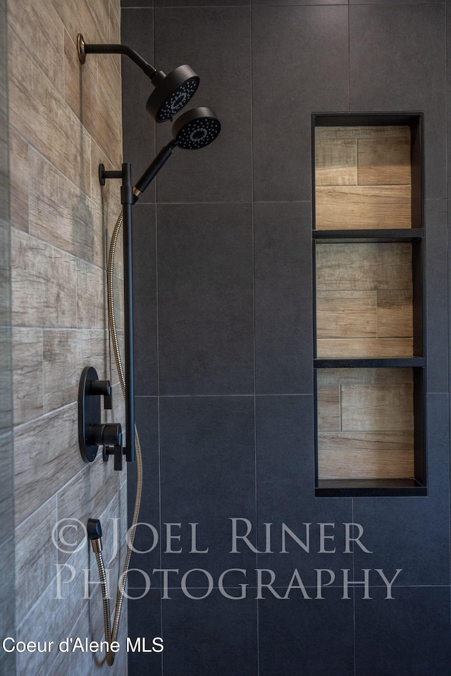 bathroom with a tile shower