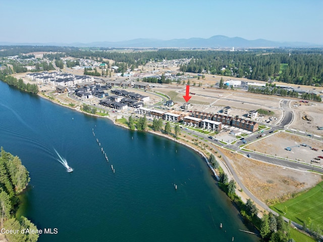 bird's eye view with a water and mountain view